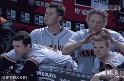 Baseball Players Sitting In Dugout GIF