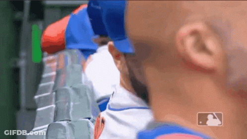 Baseball Players Sitting In Dugout GIF