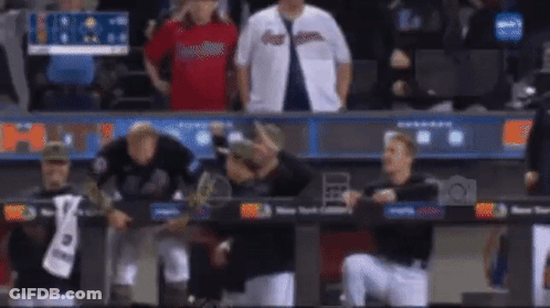 Baseball Players Standing In Dugout GIF