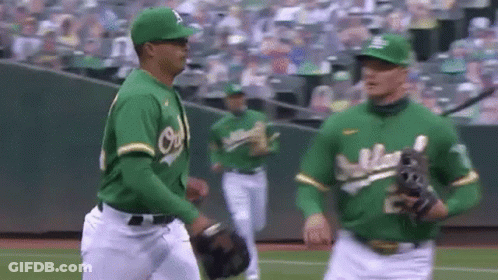 Baseball Players Standing On Field GIF