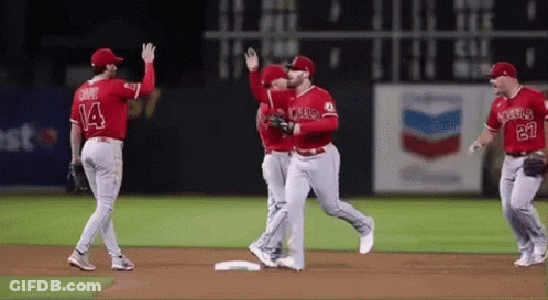 Baseball Players Standing On Field GIF