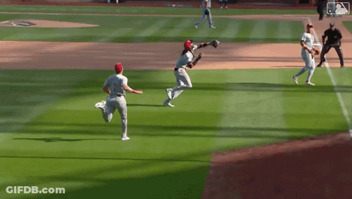 Baseball Players Standing On Field GIF