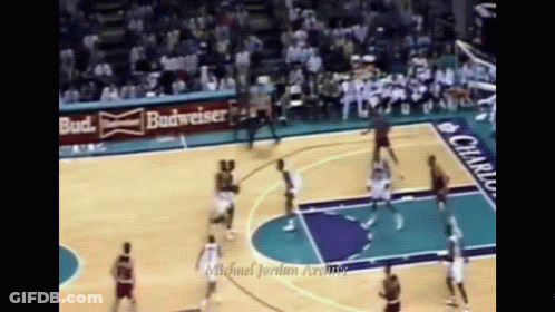 Basketball Game In Front Of Budweiser Ad GIF