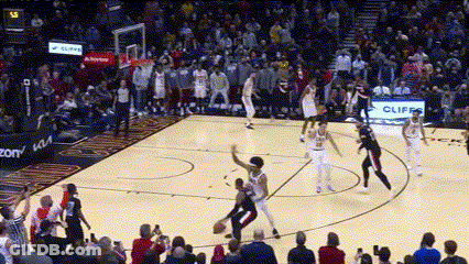 Basketball Game In Front Of Crowd With Cliff Sign GIF