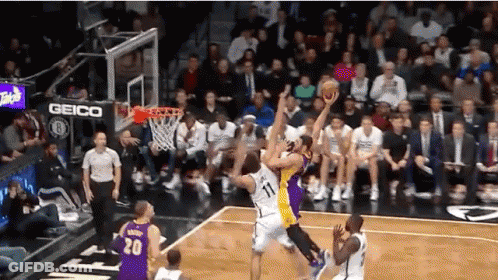 Basketball Game In Front Of Crowd With Geico Sign GIF