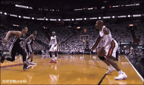 Basketball Game In Front Of Crowd With Heat Sign GIF