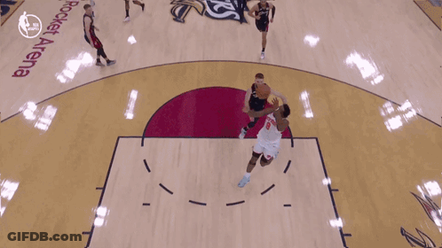 Basketball Game In Front Of Emirates Banner GIF