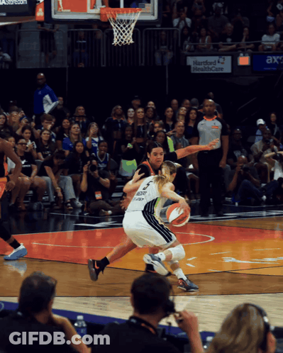 Basketball Game In Front Of Hartford Health Care Sign GIF