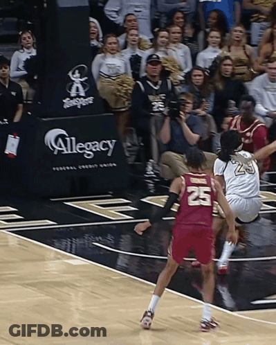 Basketball Game In Front Of Legacy Banner GIF