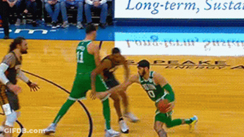 Basketball Game In Front Of Long-Term Sustainable Sign GIF