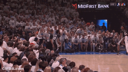 Basketball Game In Front Of Midfirst Bank Ad GIF