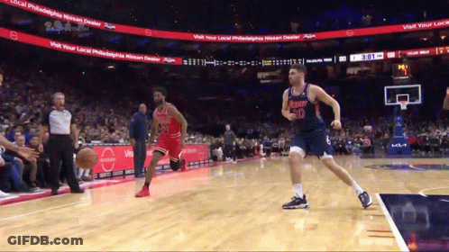 Basketball Game In Front Of Nissan Sign GIF