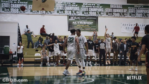 Basketball Game In Front Of Nutrishop Banner GIF