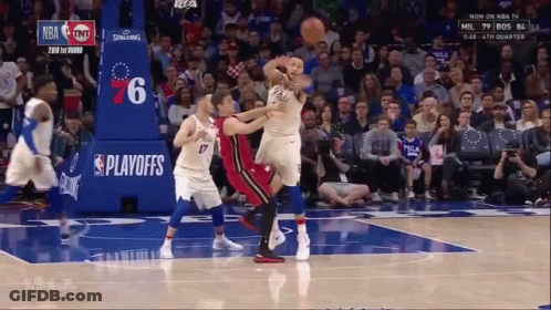 Basketball Game In Front Of Playoffs Banner GIF