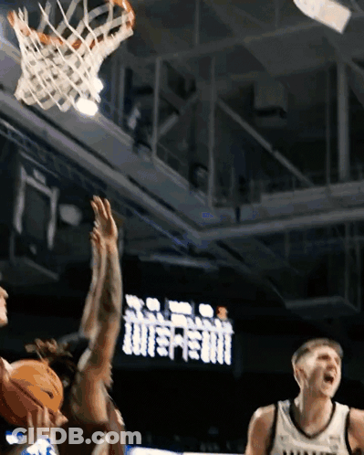Basketball Game In Front Of Scoreboard Saying Tottenham GIF