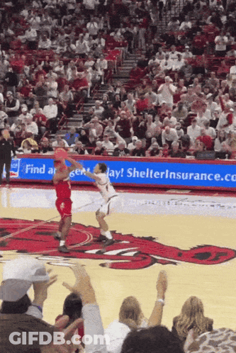 Basketball Game In Front Of Shelter Insurance Sign GIF