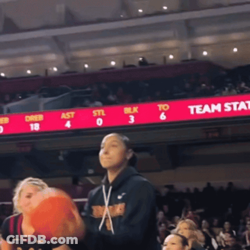 Basketball Game In Front Of Team Stat Board GIF