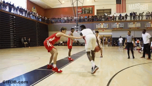 Basketball Game In Gym With Marsheel On Wall GIF