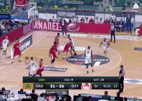 Basketball Game In Stadium With Ocomote Banner GIF