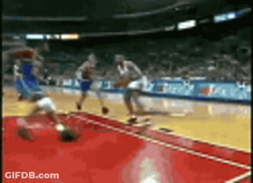 Basketball Game In Stadium With Sideline Ads GIF