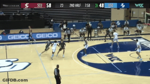Basketball Game On Court With Geico Sign GIF