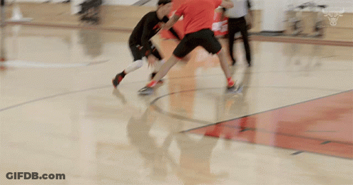 Basketball Game On Court With Spalding Sign GIF