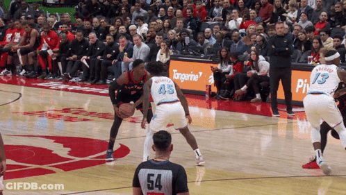 Basketball Game On Court With Tangerine Sign GIF