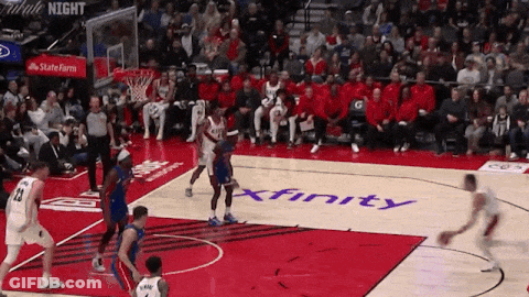 Basketball Game On Court With Xfinity Logo GIF