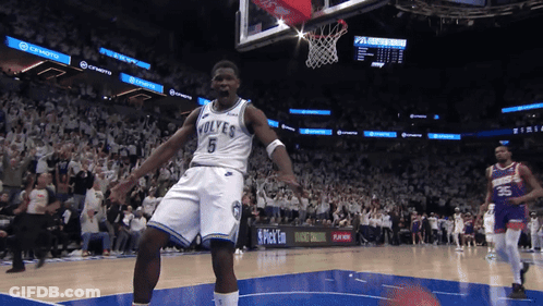 Basketball Player Celebrating Dunk In Wolves Jersey GIF