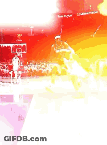 Basketball Player Dribbling Against Defender GIF