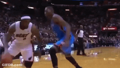 Basketball Player Dribbling Heat Jersey GIF
