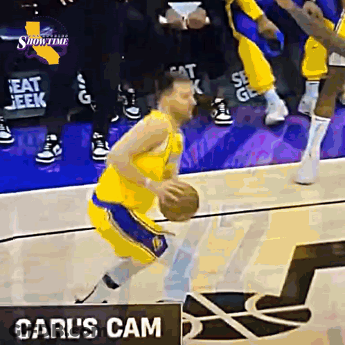 Basketball Player Dribbling In Front Of Carl's Cam Sign GIF
