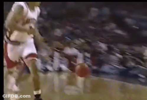 Basketball Player Dribbling In Front Of Crowd GIF