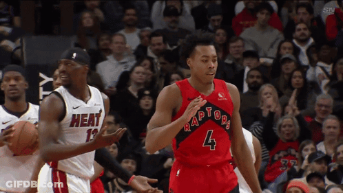 Basketball Player Dribbling In Red Raptors Jersey GIF