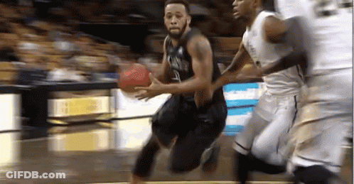 Basketball Player Dribbling Past Defender GIF