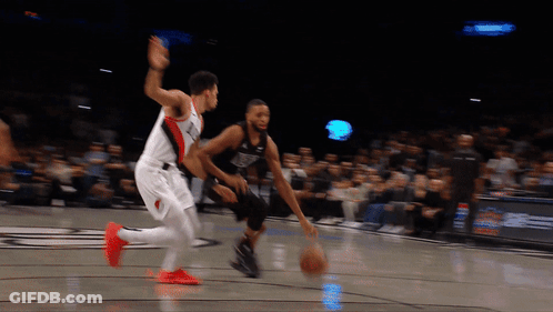 Basketball Player Dribbling While Another Watches GIF