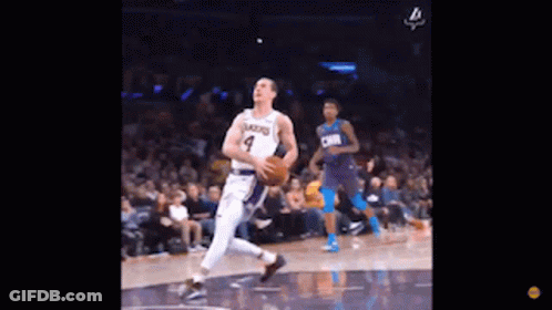 Basketball Player Dribbling While Another Watches GIF