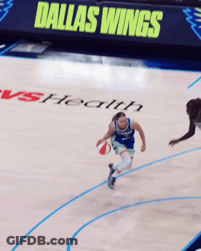 Basketball Player Dribbling With Dallas Wings Sign GIF