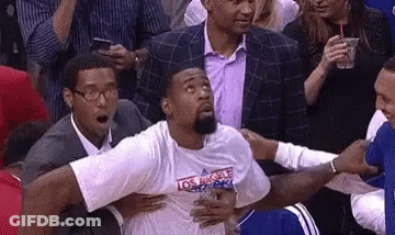 Basketball Player Held By Men In Crowd GIF