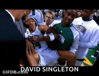 Basketball Player Held Up By Man In Suit David Singleton GIF