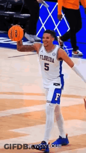Basketball Player Holding Basketball Smiling GIF