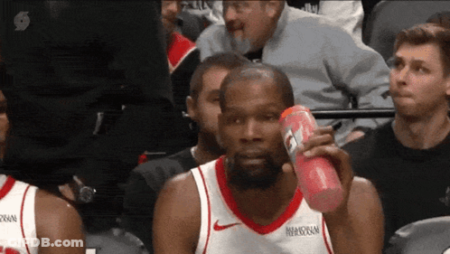 Basketball Player Holding Gatorade Bottle GIF