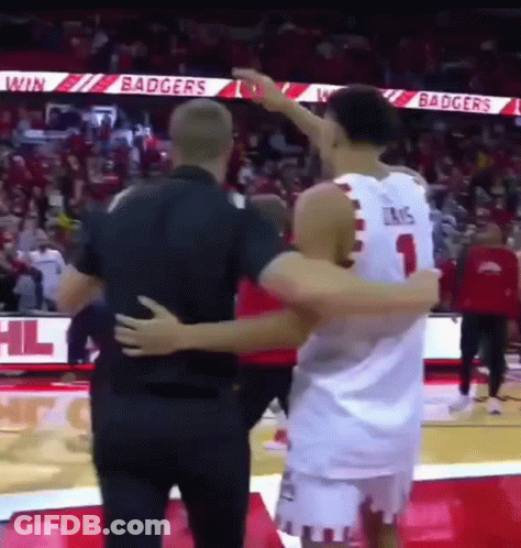 Basketball Player Hugging Another Player On Court GIF