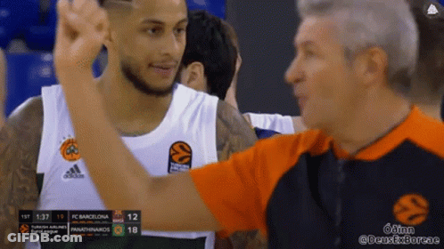Basketball Player In Adidas Jersey Next To Referee GIF