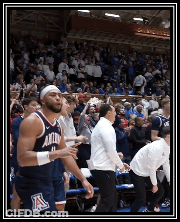 Basketball Player In Arizona Jersey Surrounded By Fans GIF