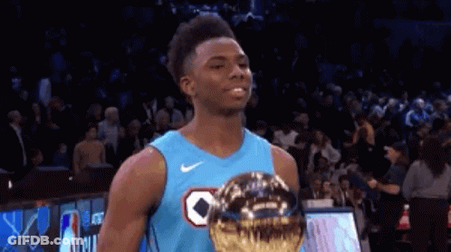 Basketball Player In Blue Jersey Holding Trophy GIF
