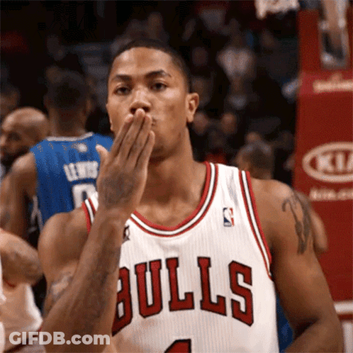 Basketball Player In Bulls Jersey Blowing A Kiss GIF
