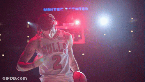 Basketball Player In Bulls Jersey Holding Basketball GIF