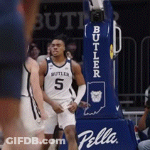 Basketball Player In Butler Jersey In Front Of Pella Hoop GIF