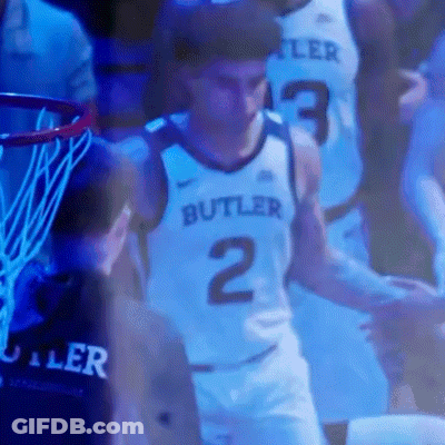 Basketball Player In Butler Jersey Standing In Front Of Hoop GIF